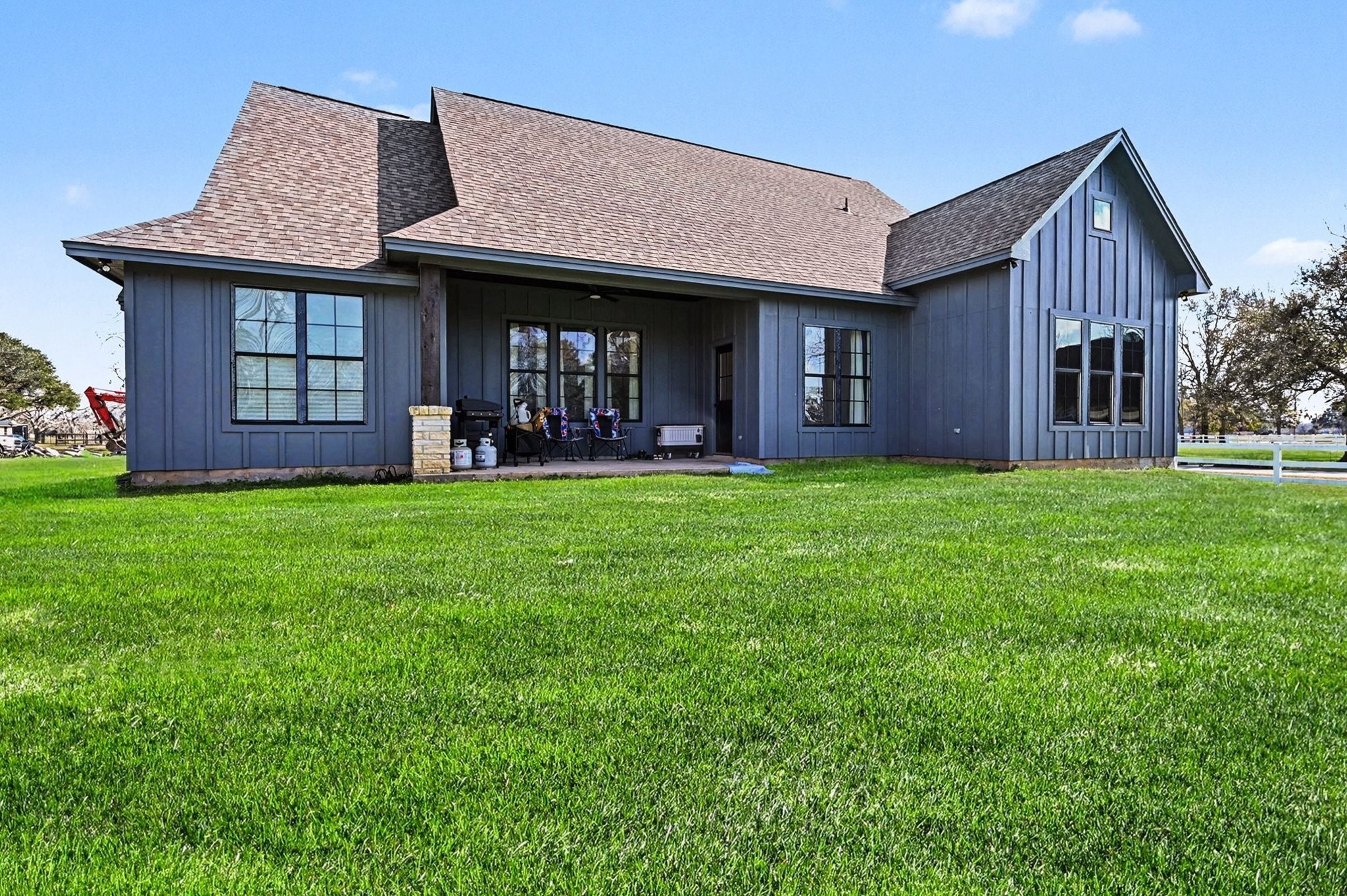 444 Mill Road Angleton, TX 77515 - Photo 28 of 31 a view of a brick house with a big yard and large trees
