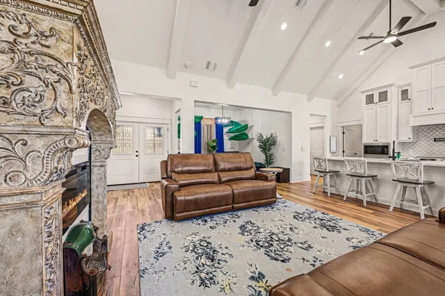 a living room with furniture and a rug