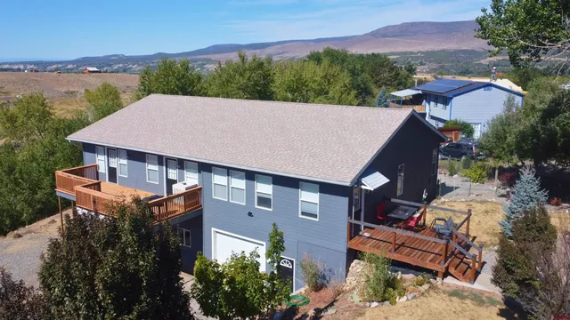 an aerial view of a house with a garden