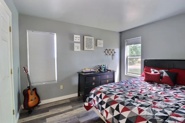 a bedroom with a bed and window