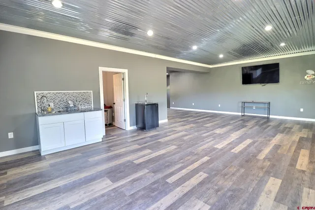 a view of a livingroom with an empty space and a fireplace