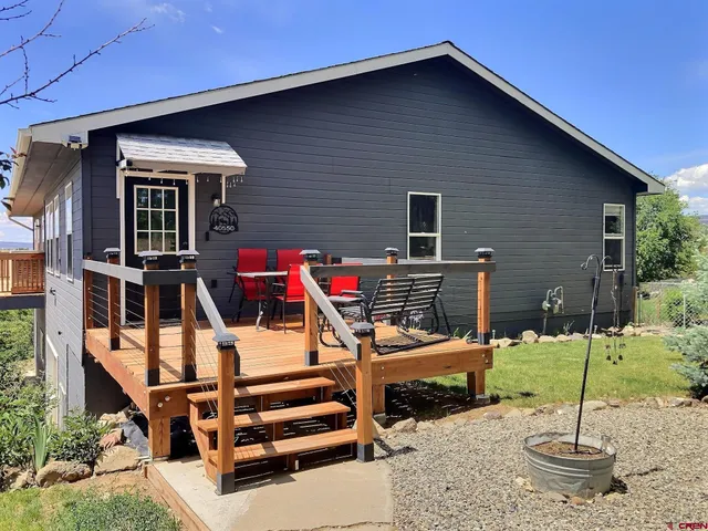 a backyard of a house with barbeque oven