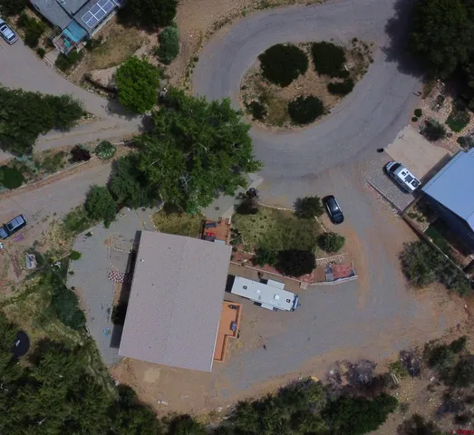 an aerial view of house with yard