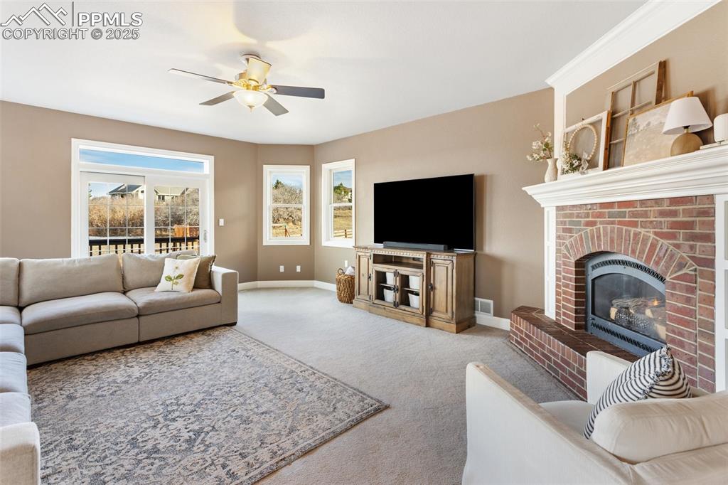 931 Forest View Road Monument, CO 80132 - Photo 16 of 50 a living room with furniture and a flat screen tv