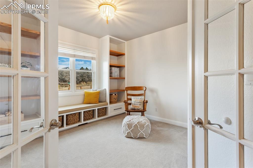 931 Forest View Road Monument, CO 80132 - Photo 18 of 50 a room with furniture and windows