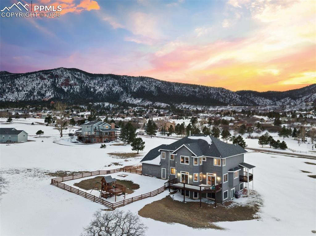 931 Forest View Road Monument, CO 80132 - Photo 2 of 50 a view of a swimming pool and mountains in the background