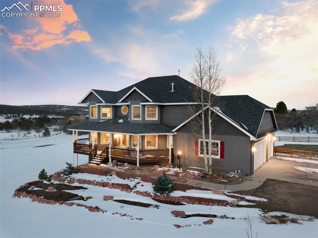 931 Forest View Road Monument, CO 80132 - Photo 3 of 50 a front view of a house with garden