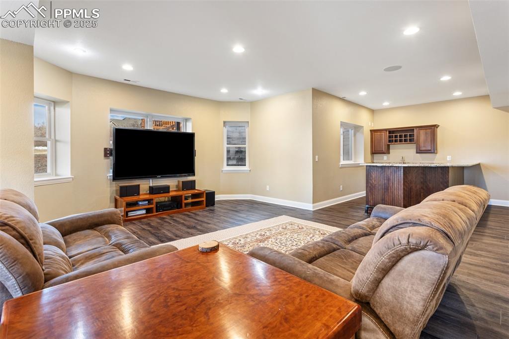 931 Forest View Road Monument, CO 80132 - Photo 35 of 50 a living room with furniture and a flat screen tv
