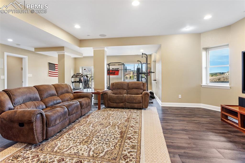 931 Forest View Road Monument, CO 80132 - Photo 36 of 50 a living room with furniture and a rug