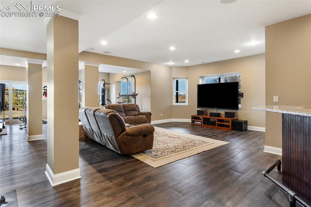 931 Forest View Road Monument, CO 80132 - Photo 37 of 50 a living room with furniture and a flat screen tv