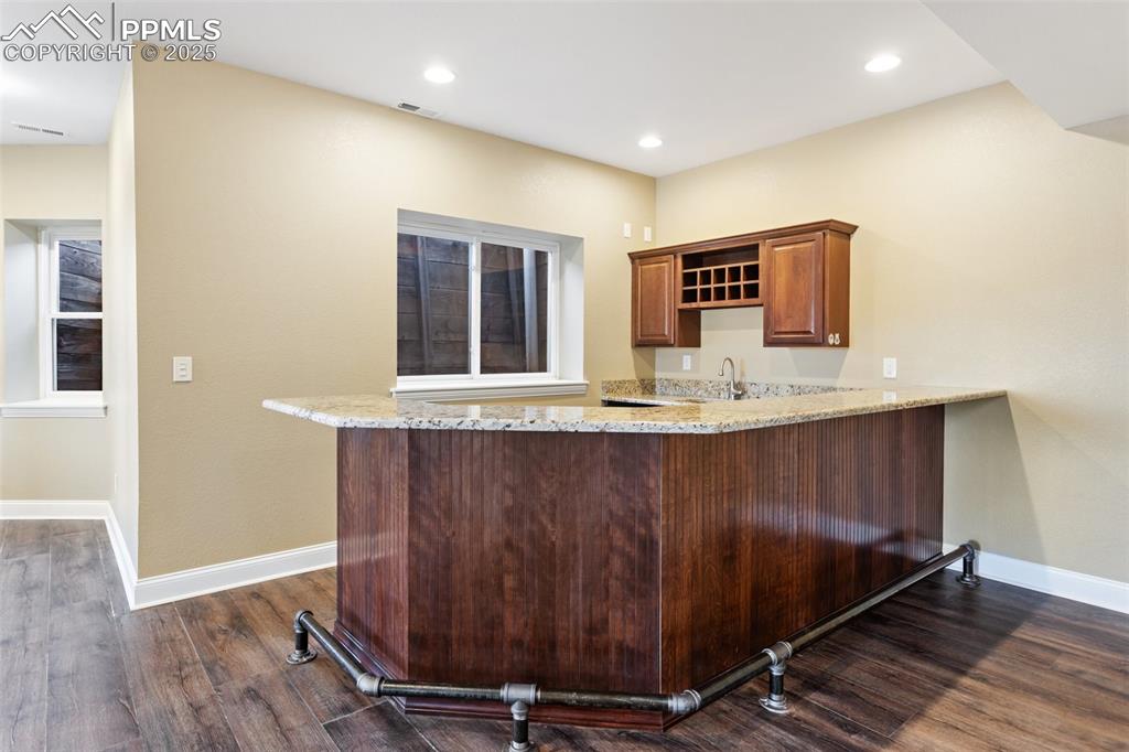 931 Forest View Road Monument, CO 80132 - Photo 39 of 50 a view of kitchen with granite countertop wall space and wooden floor