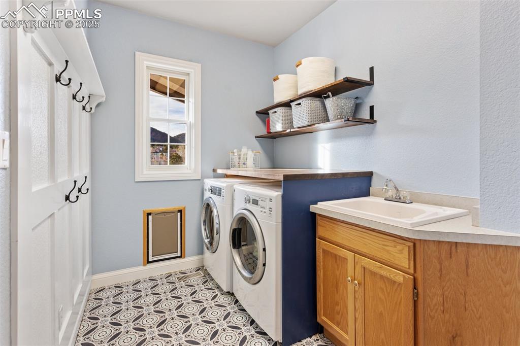 931 Forest View Road Monument, CO 80132 - Photo 43 of 50 a utility room with dryer and washer