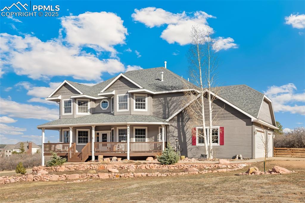 931 Forest View Road Monument, CO 80132 - Photo 5 of 50 a front view of a house with a yard