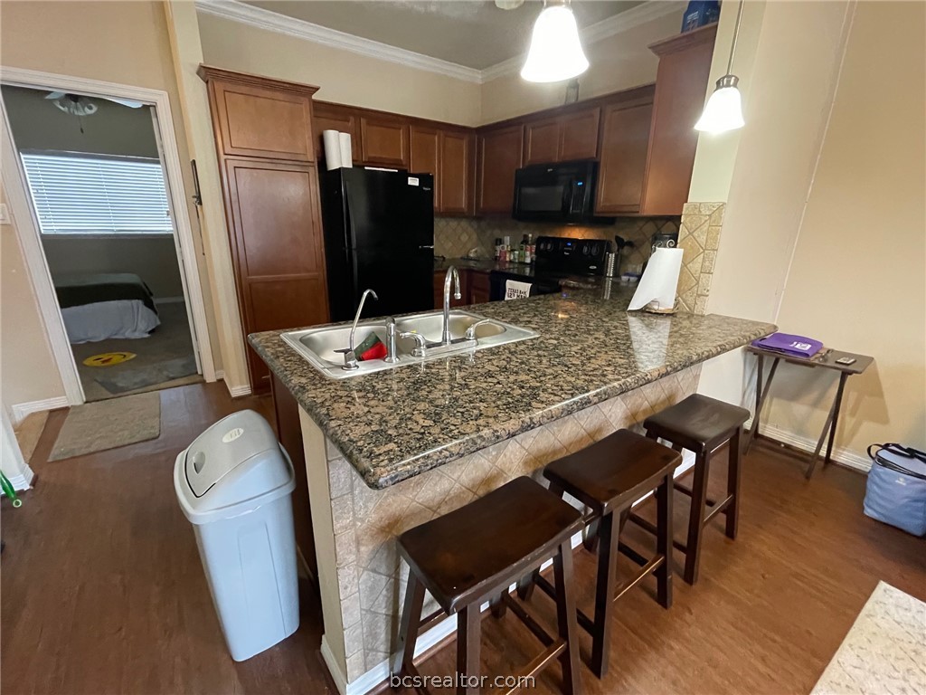1198 Jones-Butler Road, Unit 2706 College Station, TX 77840 - Photo 5 of 17 a kitchen view of a dining table chairs and entryway