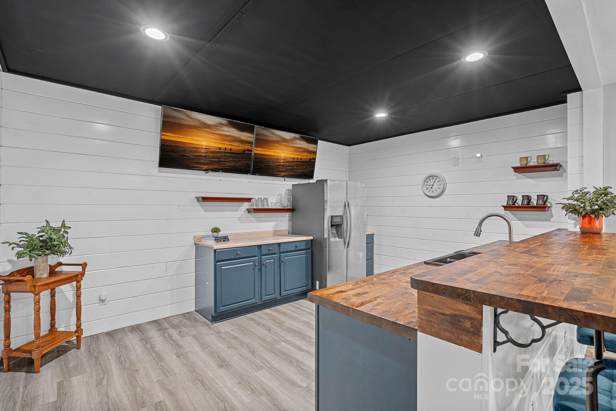 343 Gringley Hill Road Fort Mill, SC 29708 - Photo 11 of 45 a kitchen with kitchen island a sink stainless steel appliances and cabinets