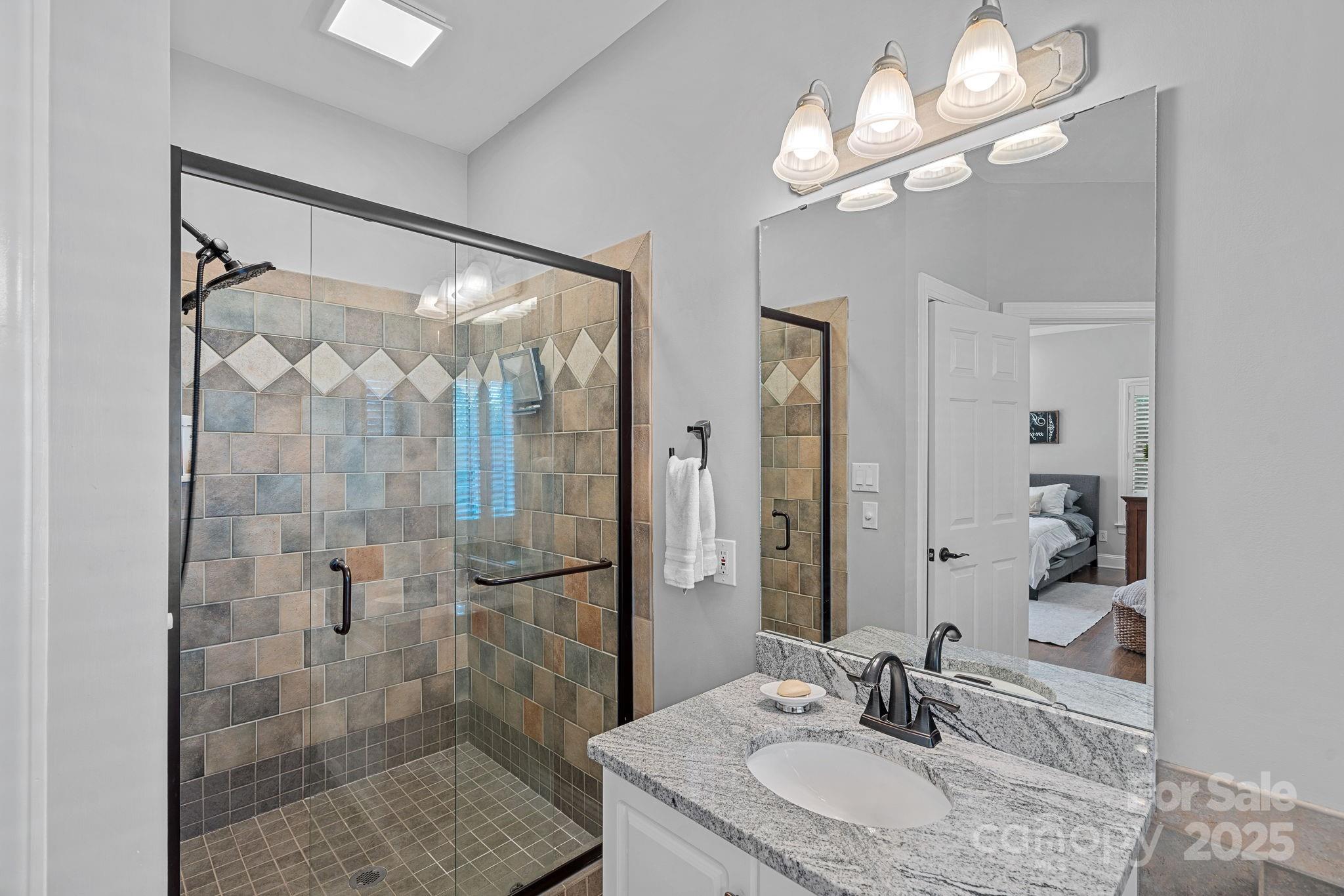 343 Gringley Hill Road Fort Mill, SC 29708 - Photo 17 of 45 a bathroom with a sink shower and a mirror
