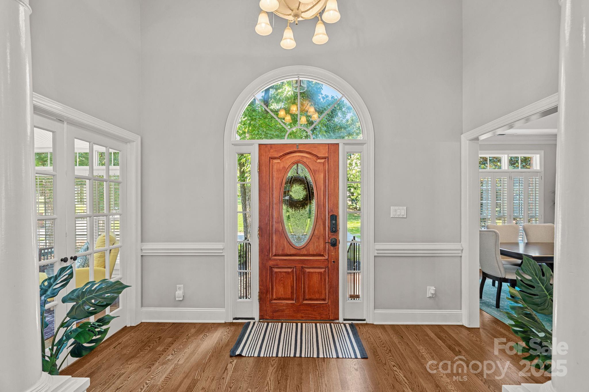 343 Gringley Hill Road Fort Mill, SC 29708 - Photo 37 of 45 an empty room with window wooden floor and front door