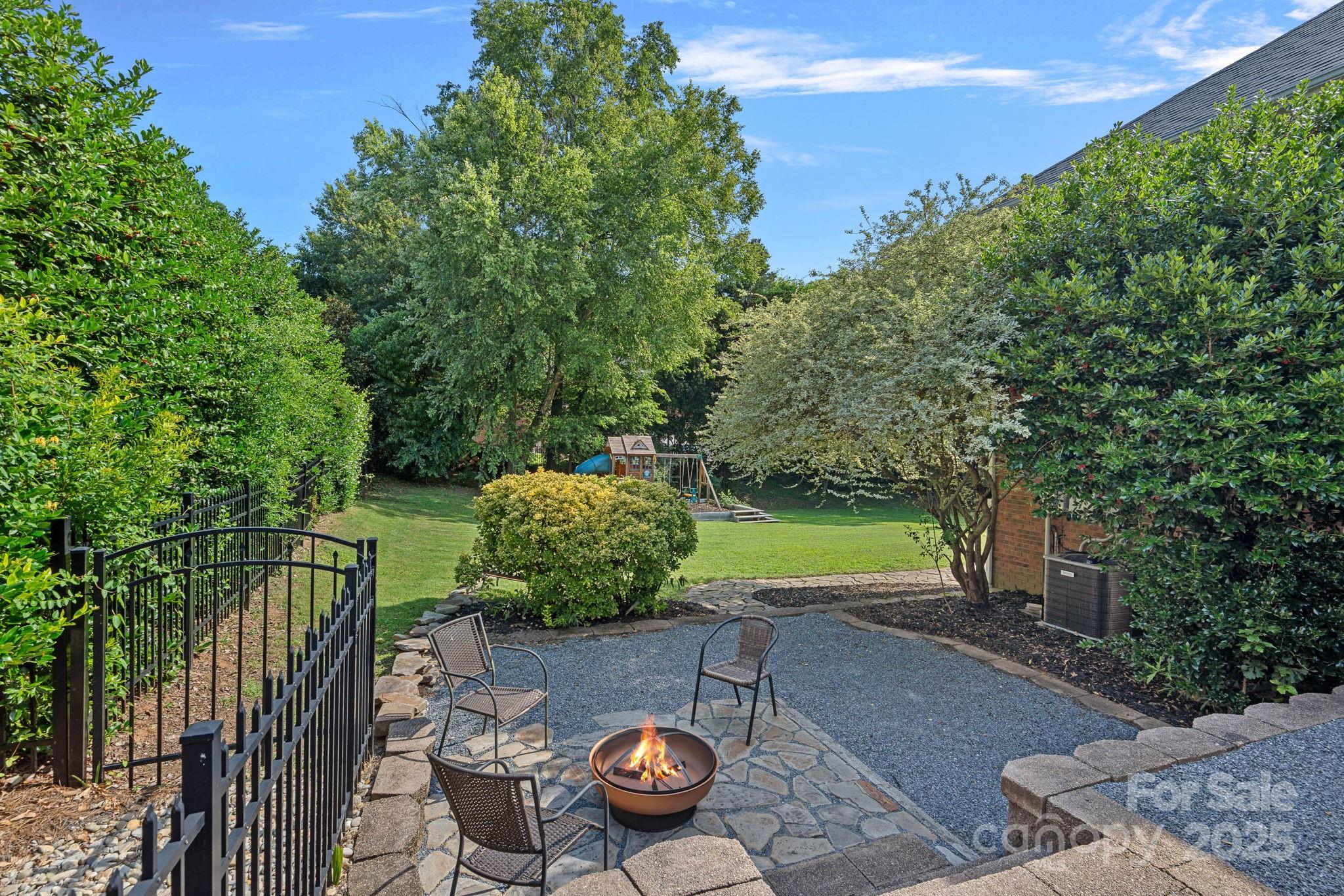 343 Gringley Hill Road Fort Mill, SC 29708 - Photo 40 of 45 a view of a patio with furniture and a garden