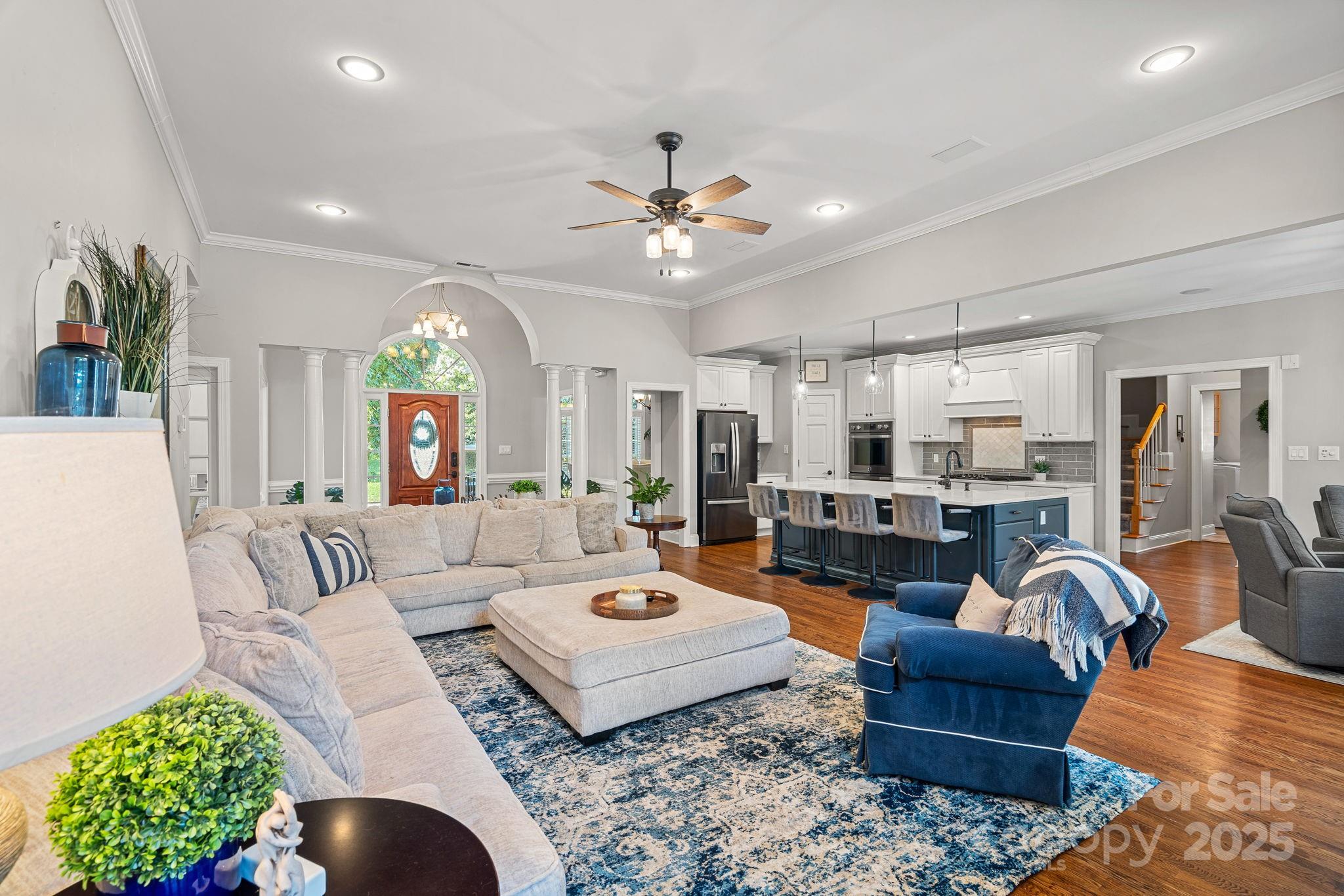 343 Gringley Hill Road Fort Mill, SC 29708 - Photo 8 of 45 a living room with furniture ceiling fan and a rug