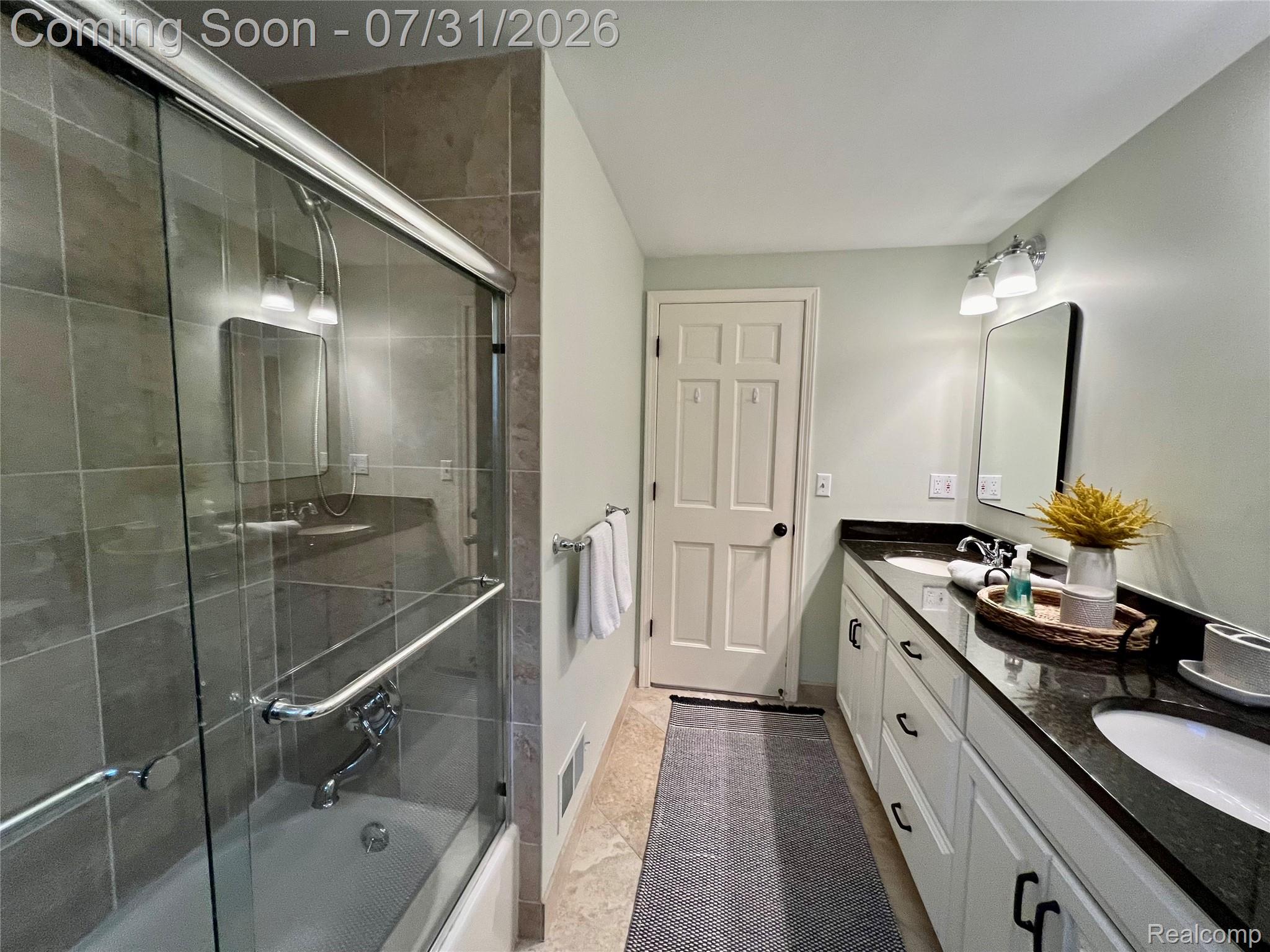 362 Lake Forest Road Rochester, MI 48309 - Photo 36 of 50 Full bathroom featuring a tiled tub/shower combination with a sliding glass door