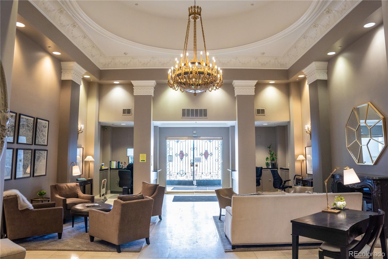 475 West 12th Avenue, Unit 15G Denver, CO 80204 - Photo 14 of 15 a living room with fireplace furniture and a chandelier