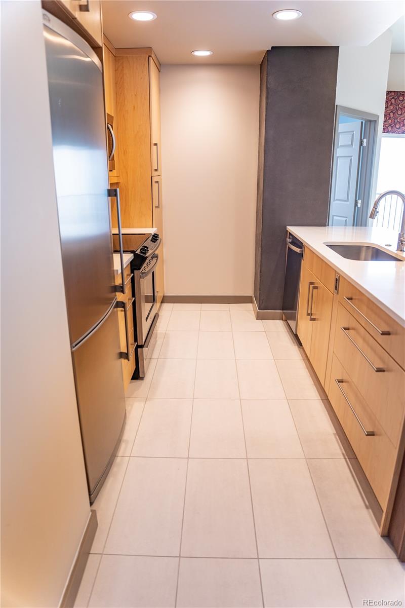 475 West 12th Avenue, Unit 15G Denver, CO 80204 - Photo 6 of 15 a view of a kitchen with utility and utility room