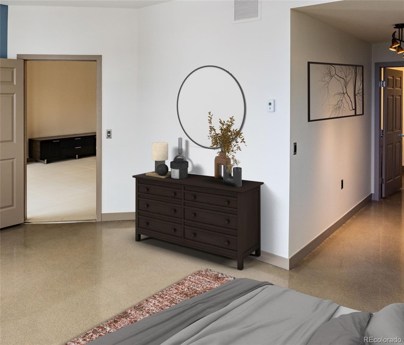 475 West 12th Avenue, Unit 15G Denver, CO 80204 - Photo 9 of 15 a room with a bed a mirror and a potted plant