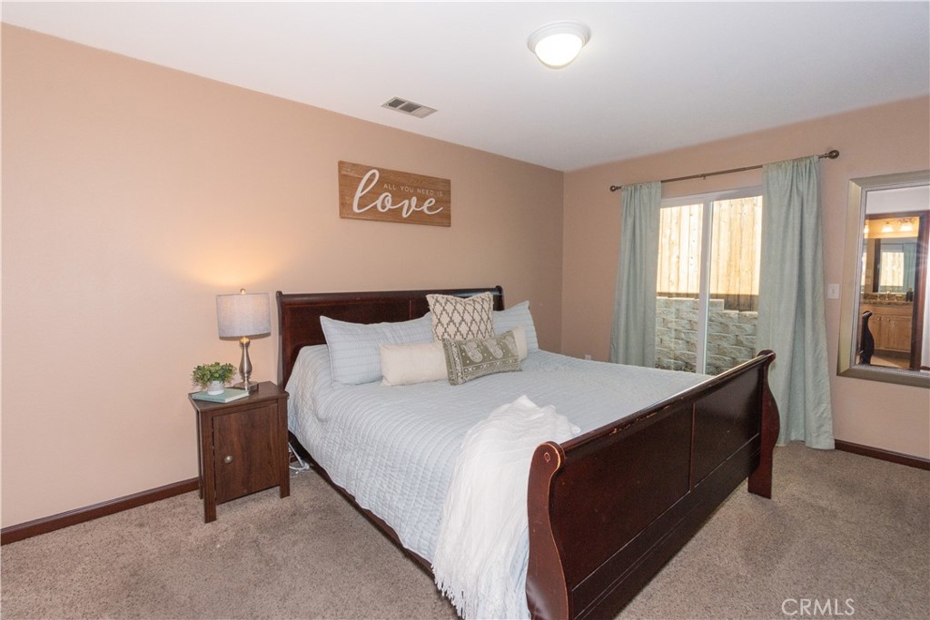 945 Creston Road Paso Robles, CA 93446 - Photo 8 of 13 a bedroom with a bed and window