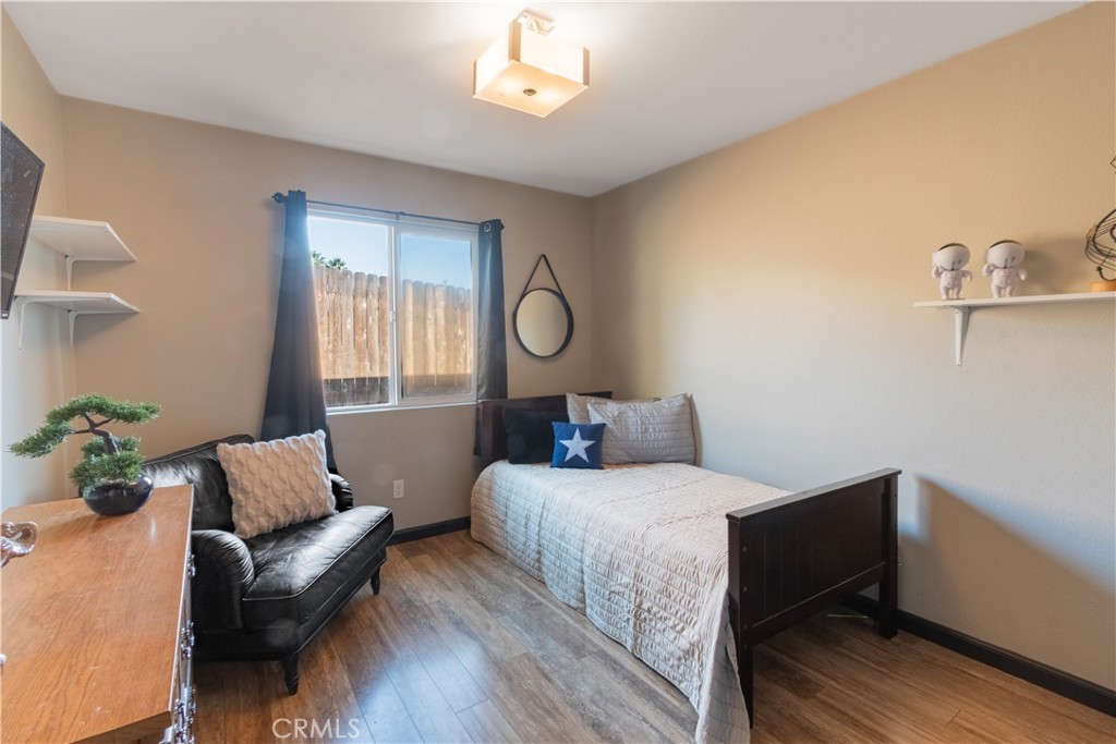 945 Creston Road Paso Robles, CA 93446 - Photo 10 of 13 a bedroom with a bed wooden floor and window