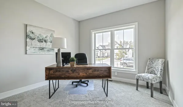 a view of a workspace with furniture