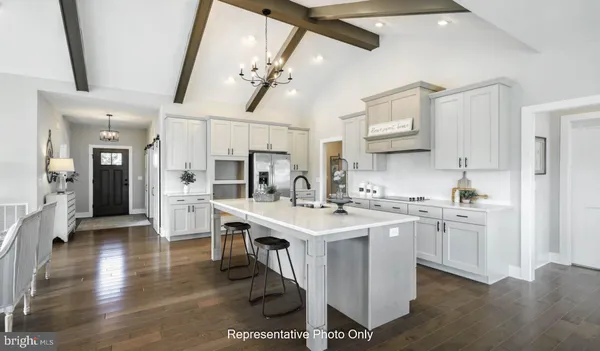 a open kitchen with stainless steel appliances granite countertop a sink stove and refrigerator