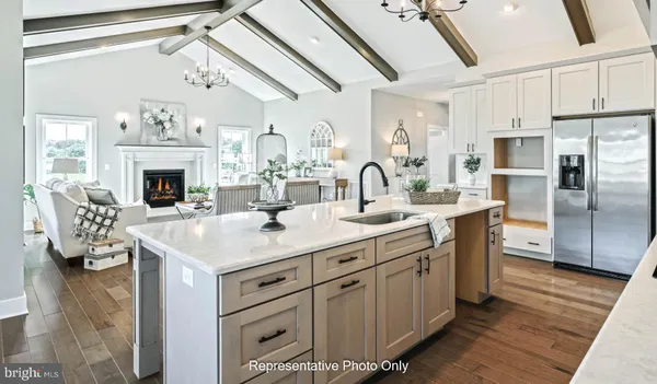 a kitchen with sink cabinets and stainless steel appliances