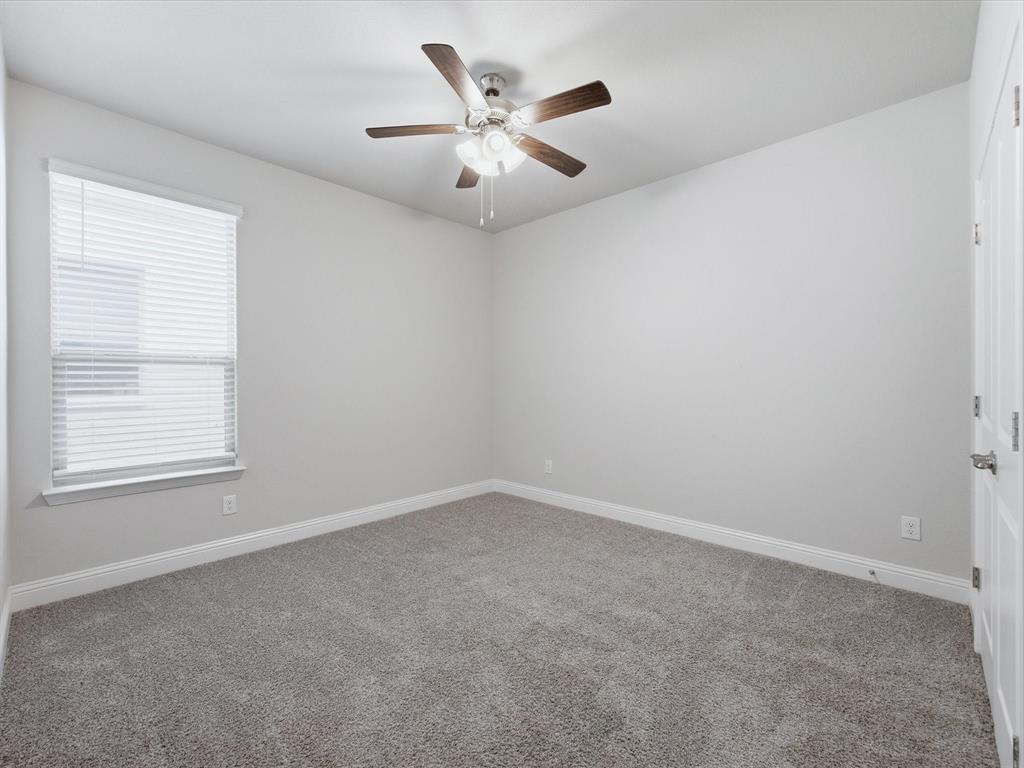 1121 Knightsbridge Road Argyle, TX 76226 - Photo 23 of 39 Bedroom featuring a ceiling fan with light fixture, window with blinds, gray carpet, and white trim