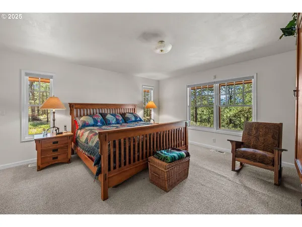 a bedroom with furniture and a window