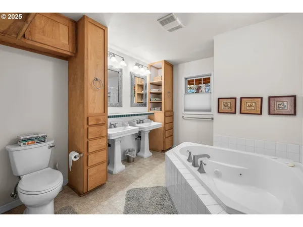 a bathroom with a toilet sink and bathtub