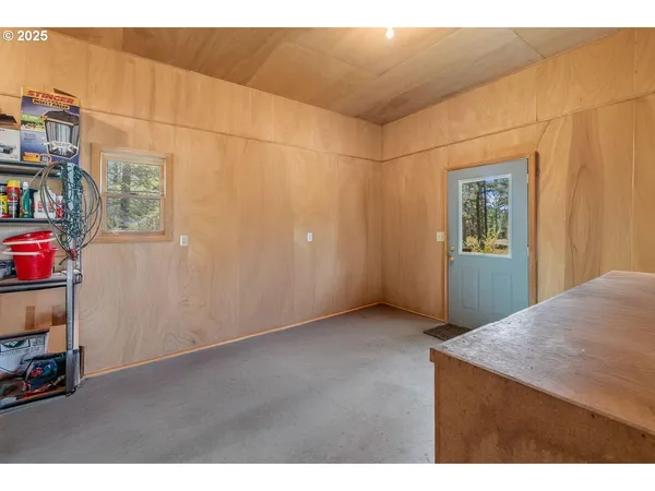 a view of a room with workspace and a window