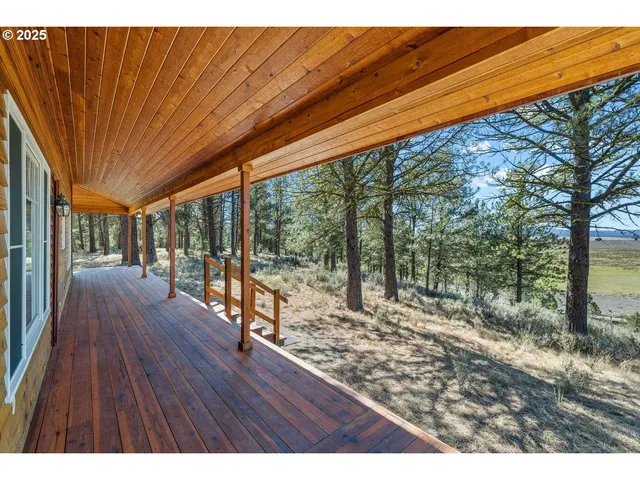 a view of a patio with wooden floor