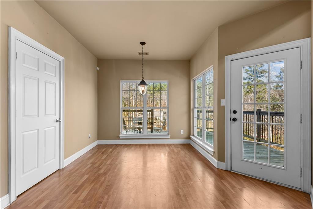 200 Bradley Road Jackson, GA 30233 - Photo 5 of 6 a view of an empty room with wooden floor and a window