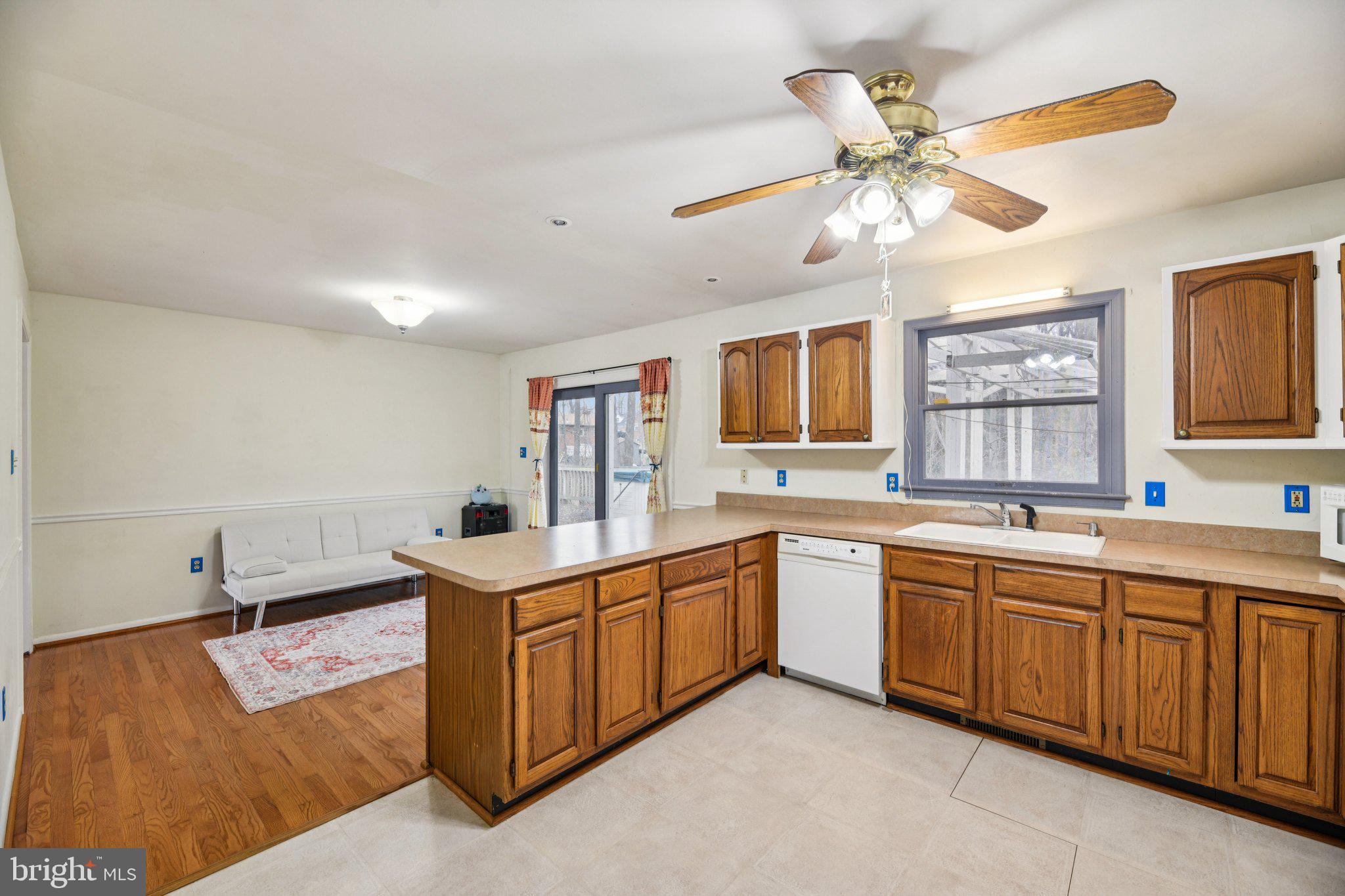 2650 Solomons Island Road Huntingtown, MD 20639 - Photo 11 of 44 a kitchen with a stove a sink and a refrigerator