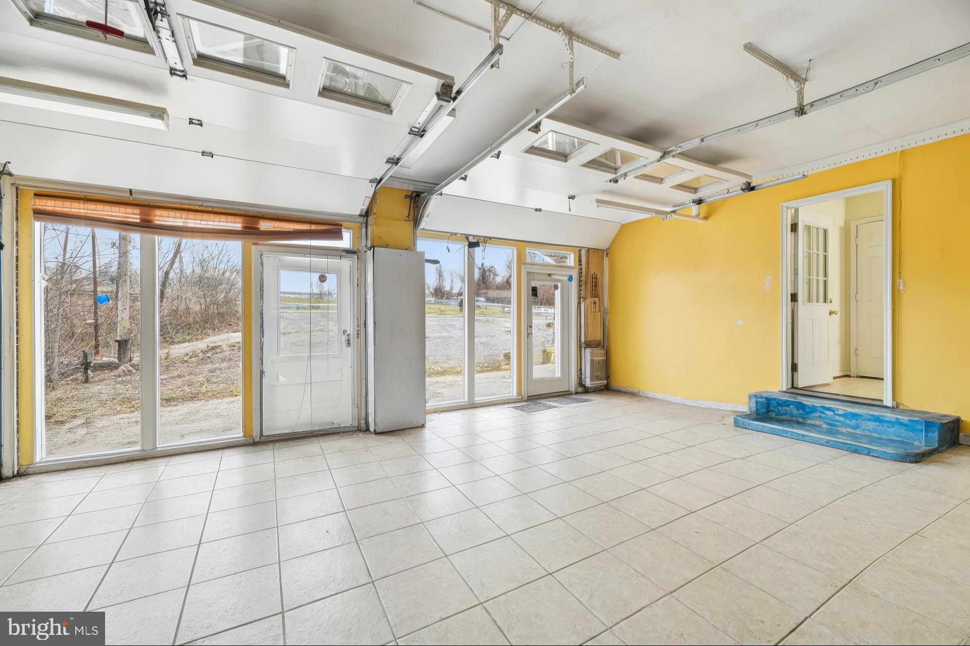2650 Solomons Island Road Huntingtown, MD 20639 - Photo 15 of 44 a view of a livingroom with a furniture and a chandelier