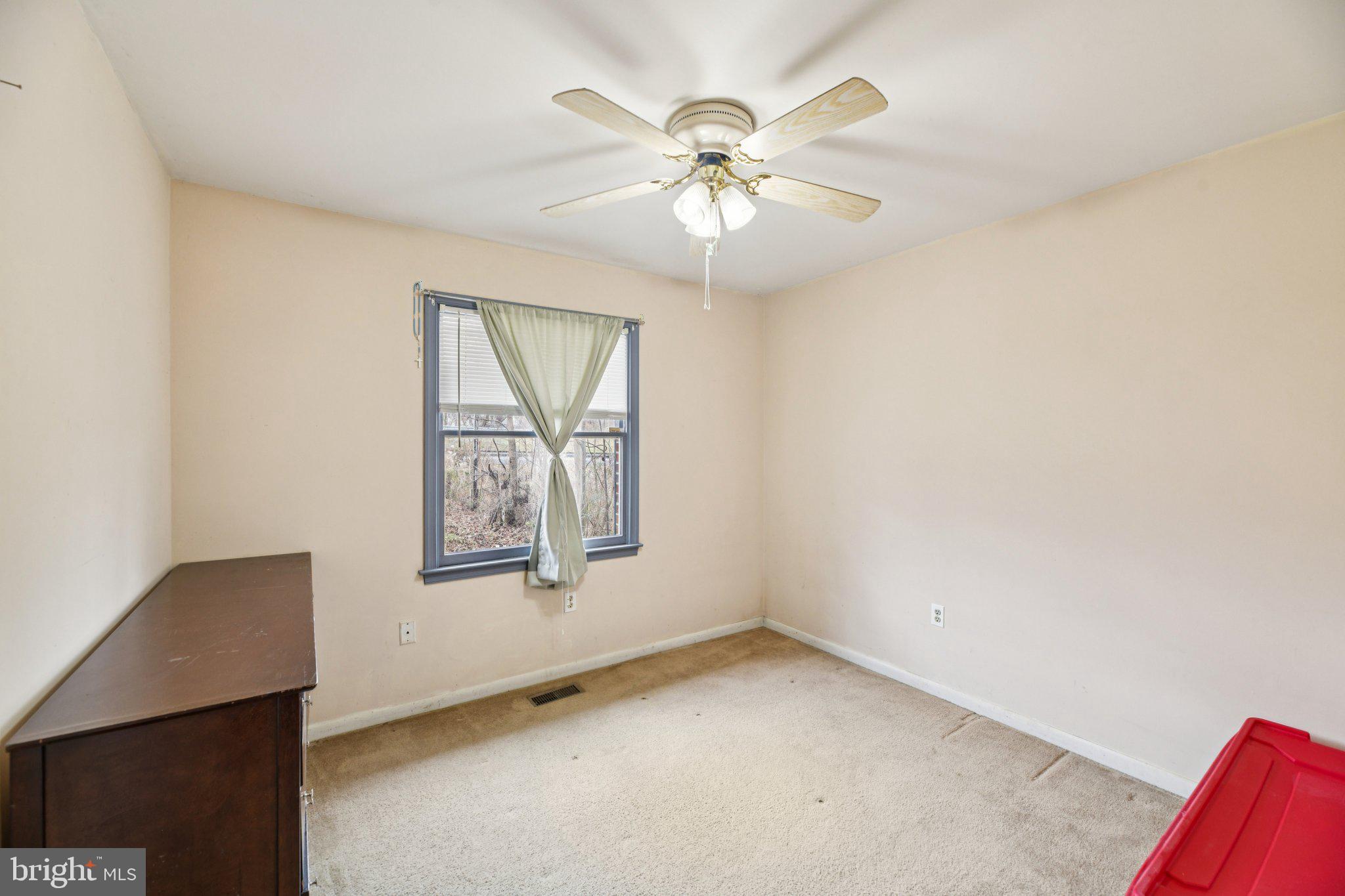 2650 Solomons Island Road Huntingtown, MD 20639 - Photo 20 of 44 an empty room with windows and fan