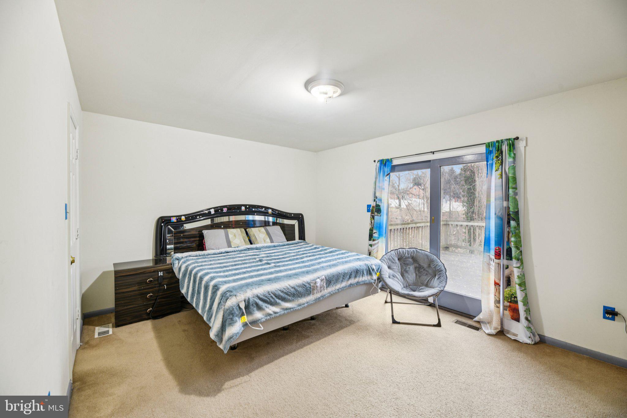 2650 Solomons Island Road Huntingtown, MD 20639 - Photo 23 of 44 a bedroom with a bed and a window