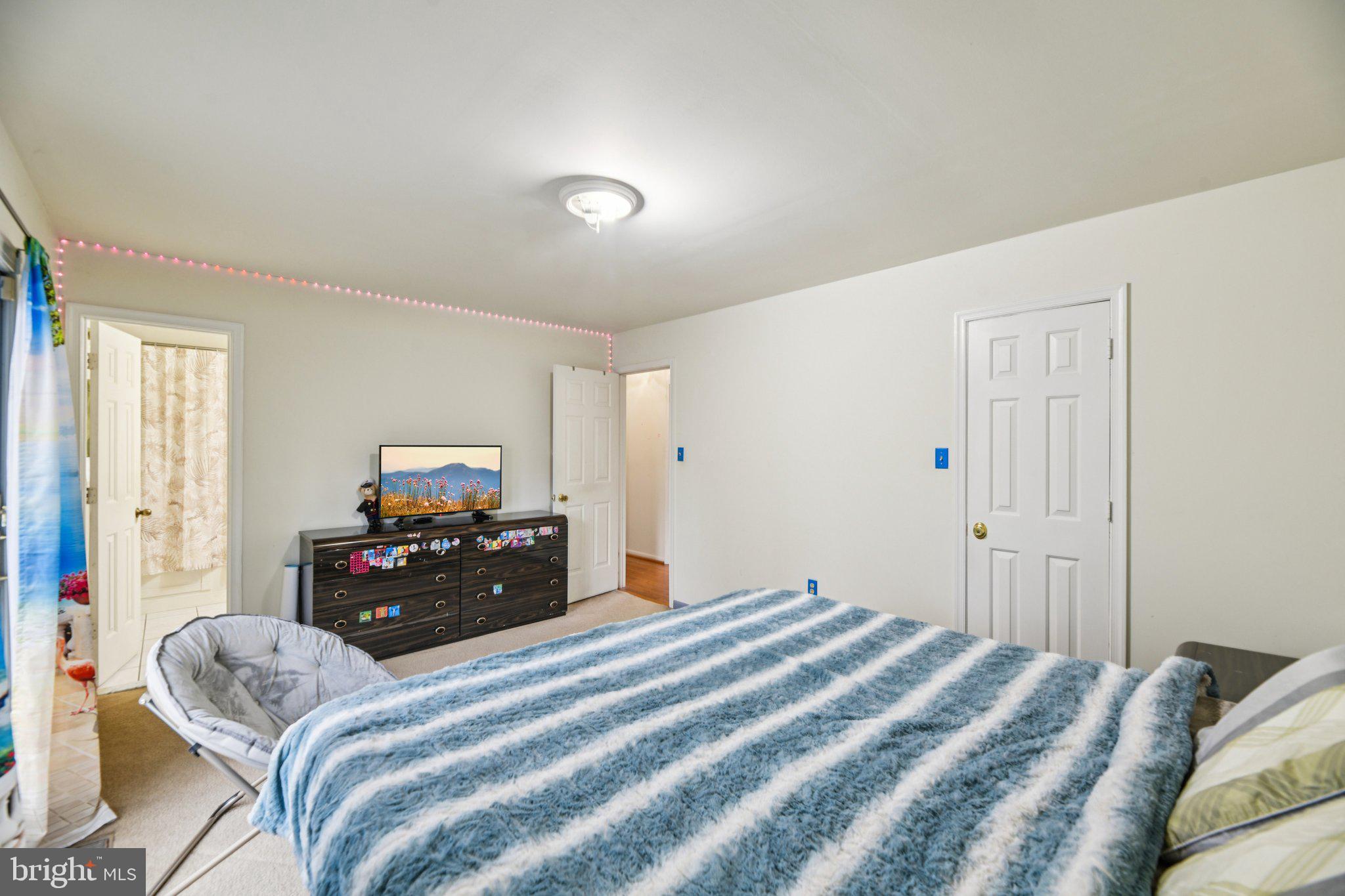 2650 Solomons Island Road Huntingtown, MD 20639 - Photo 25 of 44 a bedroom with a bed and a tv