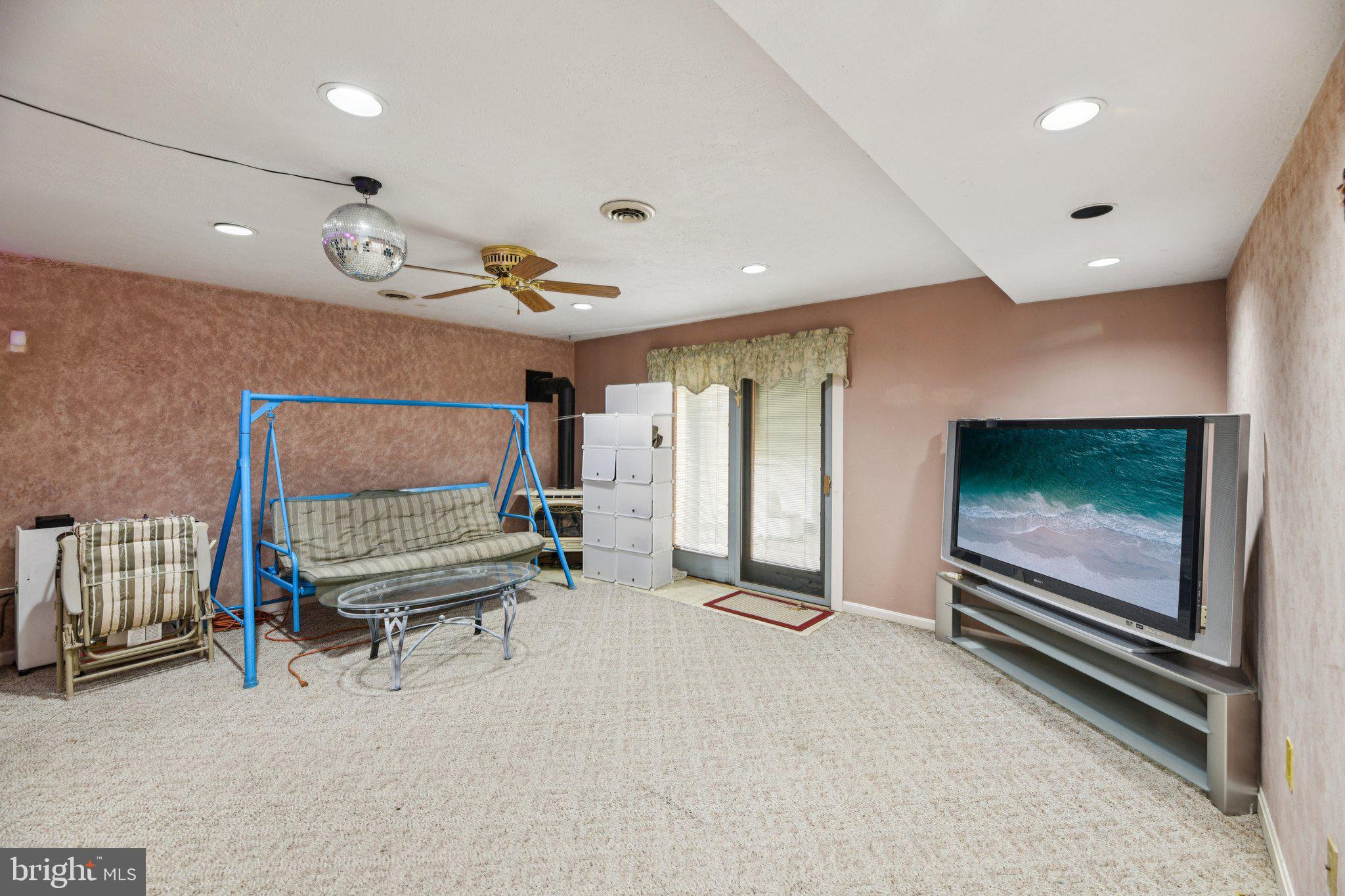 2650 Solomons Island Road Huntingtown, MD 20639 - Photo 39 of 44 a bedroom with furniture and a flat screen tv