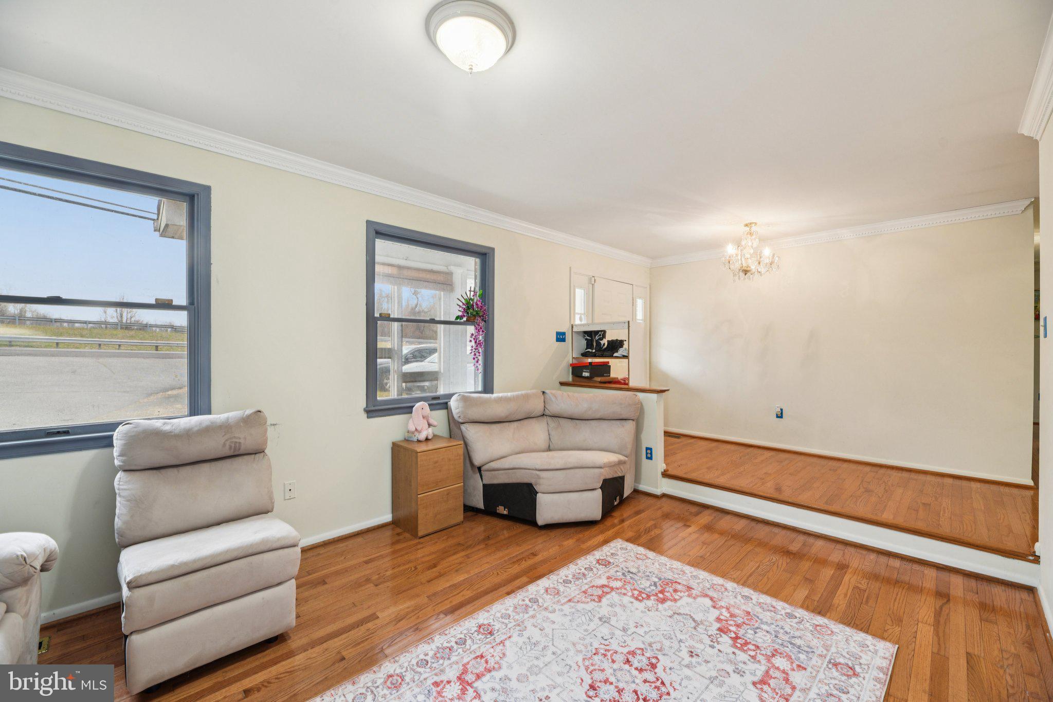 2650 Solomons Island Road Huntingtown, MD 20639 - Photo 5 of 44 a living room with furniture and a wooden floor