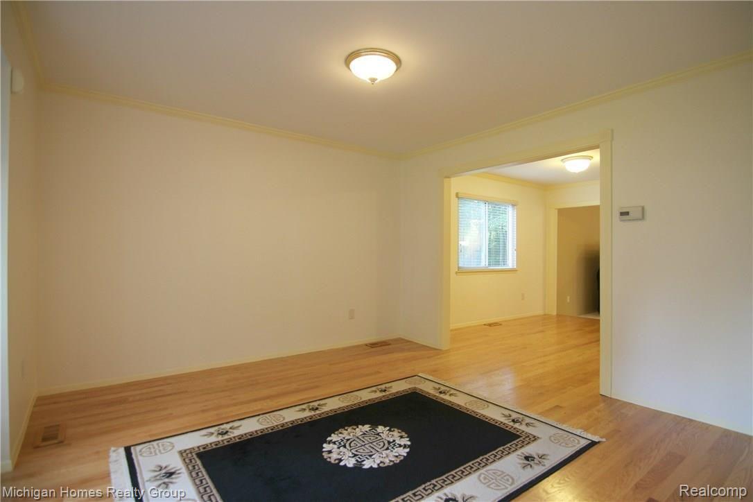 1410 Omega Road Walled Lake, MI 48390 - Photo 16 of 23 Omega Rd Living Room.jpg