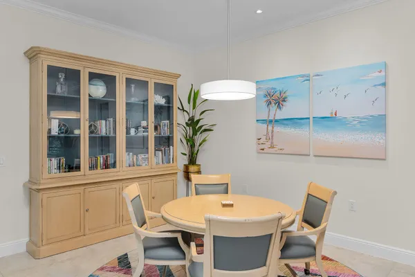 a view of a dining room with furniture and window