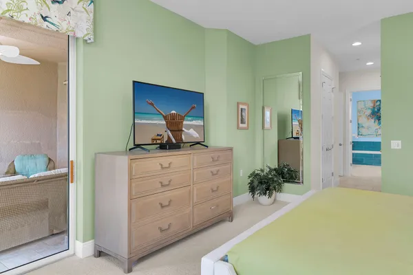 a bedroom with a bed and a dresser