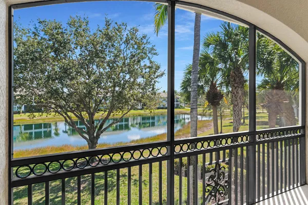 a view of a balcony with a tree