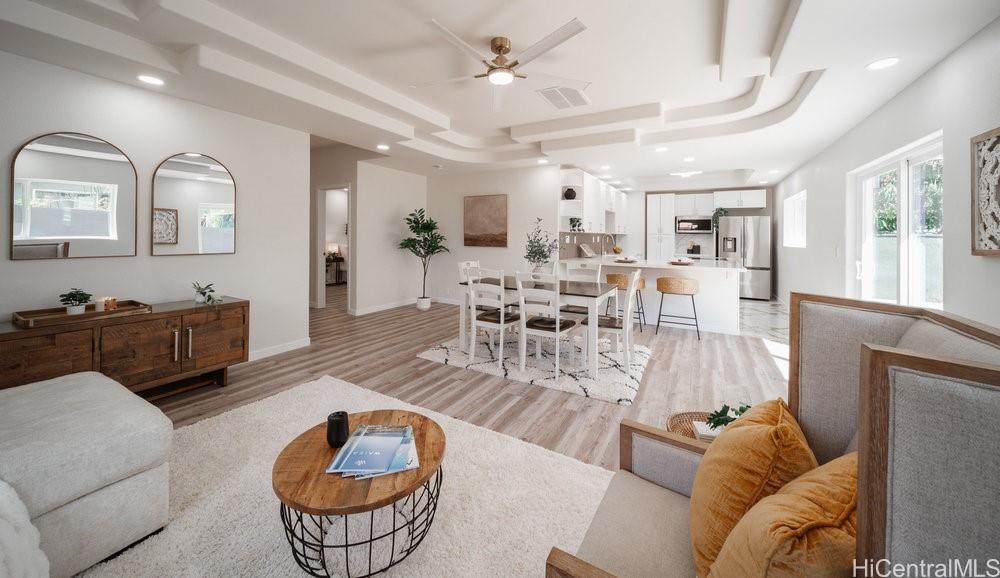 87-135 Liliana Street Waianae, HI 96792 - Photo 1 of 1 a living room with furniture and a wooden floor